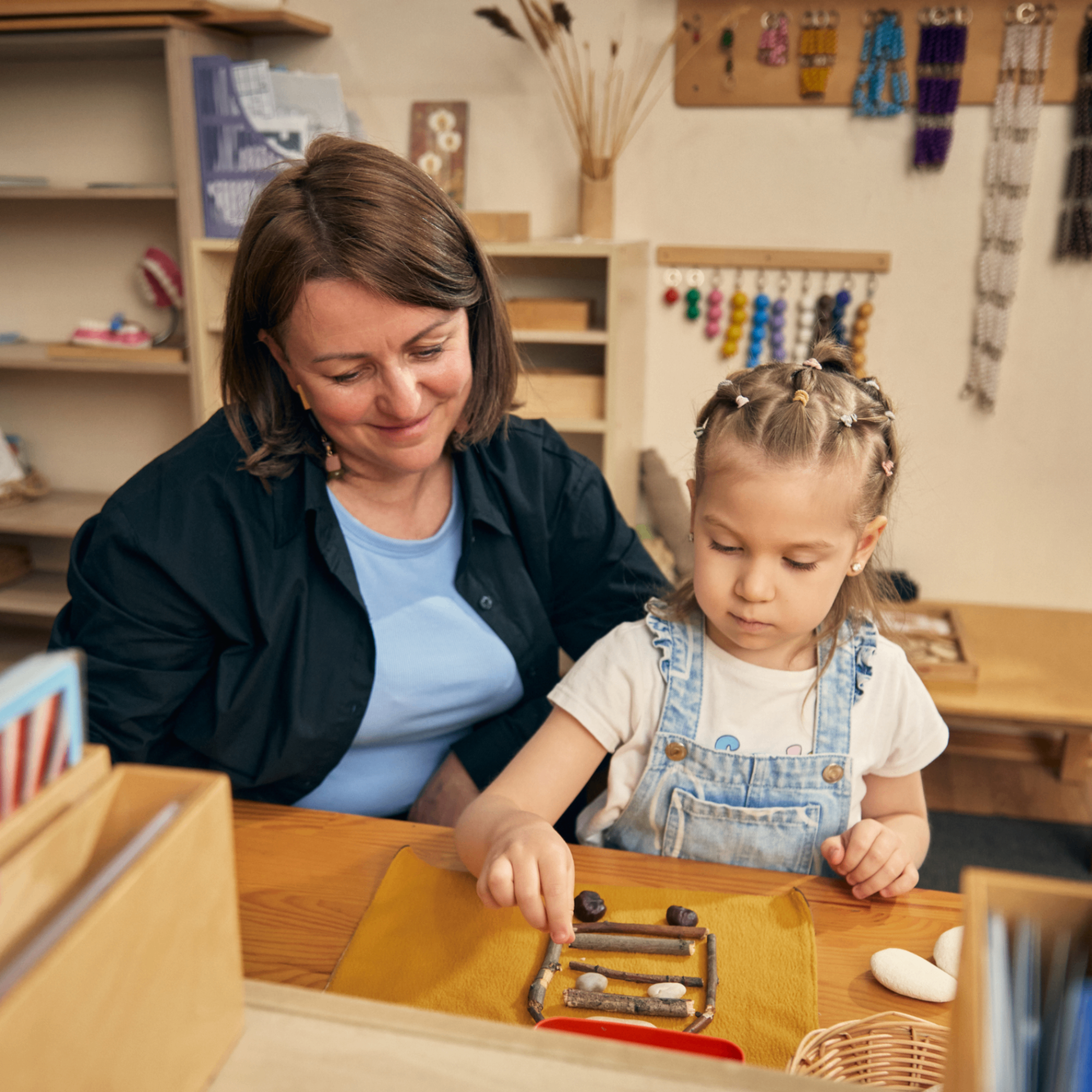 Educator playing with a baby at home
